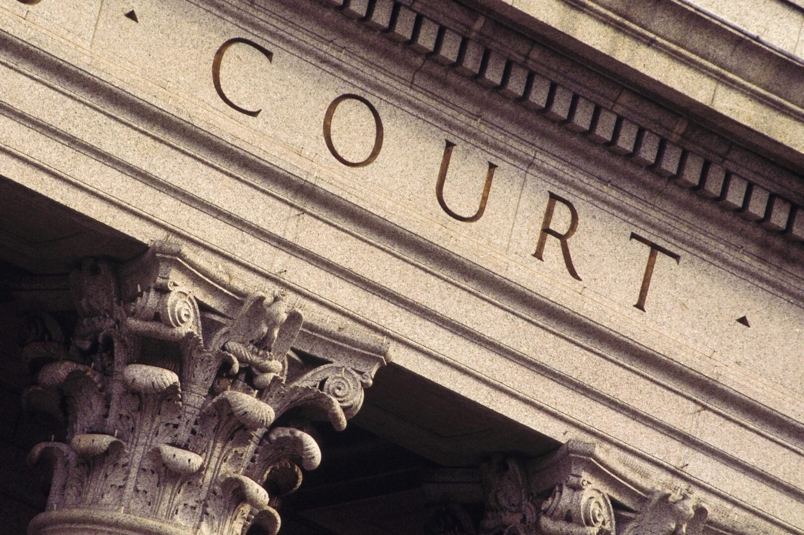 Close-up of a courthouse entrance with classical architectural details.